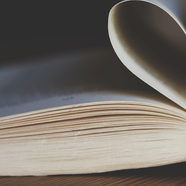 stack of romance books with roses